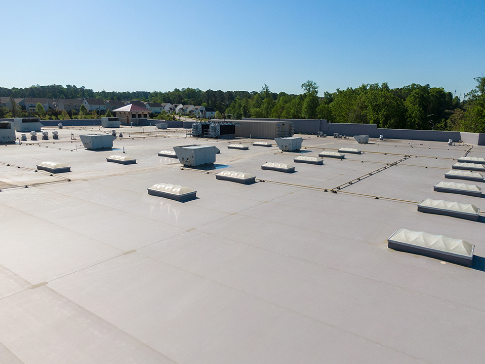 drone,images,of,tpo,commercial,roof,with,some,metal,panels